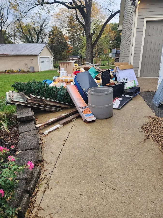 Dumpster being loaded with debris for 3 Yard Dumpster Rental in Evesham